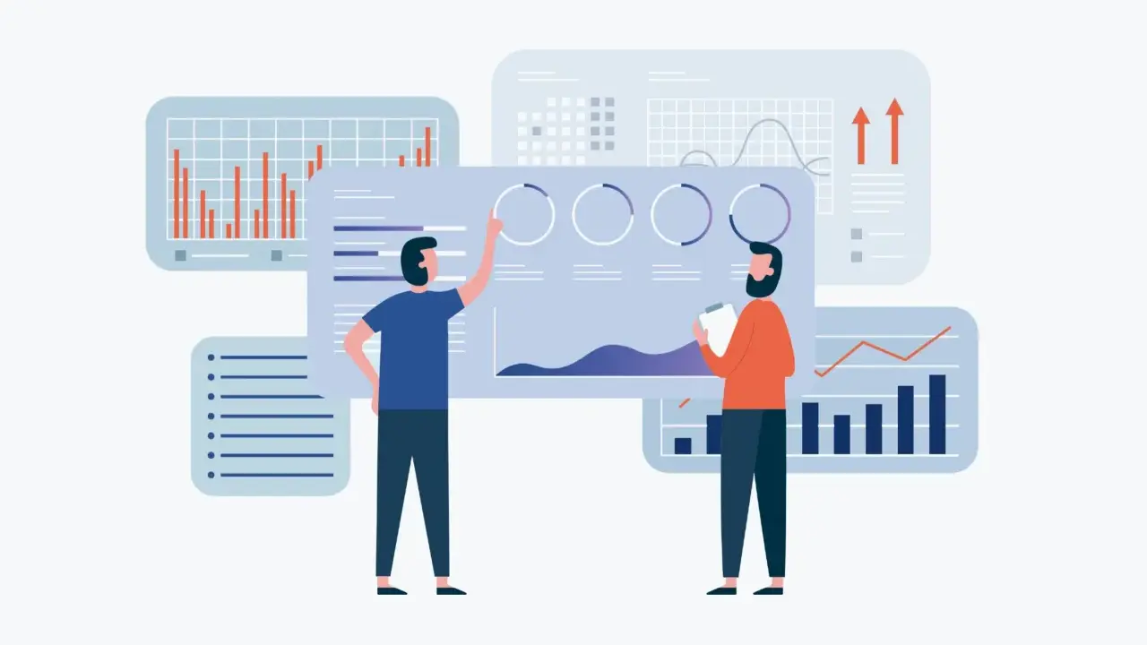 Due persone analizzano grafici e dati, un team che lavora con hr analytics per migliorare le performance aziendali.