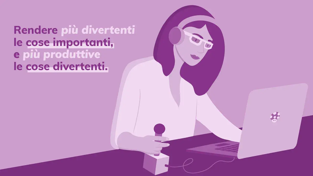 La gamification in azienda rende le sfide più divertenti e il lavoro più produttivo. Una donna con cuffie e occhiali lavora al laptop, con un microfono in mano.