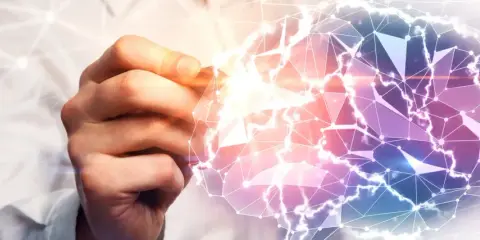 Mano che disegna un cervello stilizzato, connettendo punti e linee. Un'immagine che evoca la complessità della mente e la domanda: quanto guadagna uno psicologo?